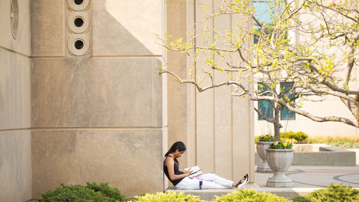 student reading in front of Madonna della Strada chapel