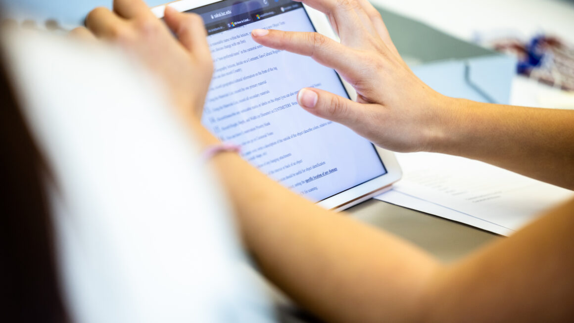 hands using a digital tablet