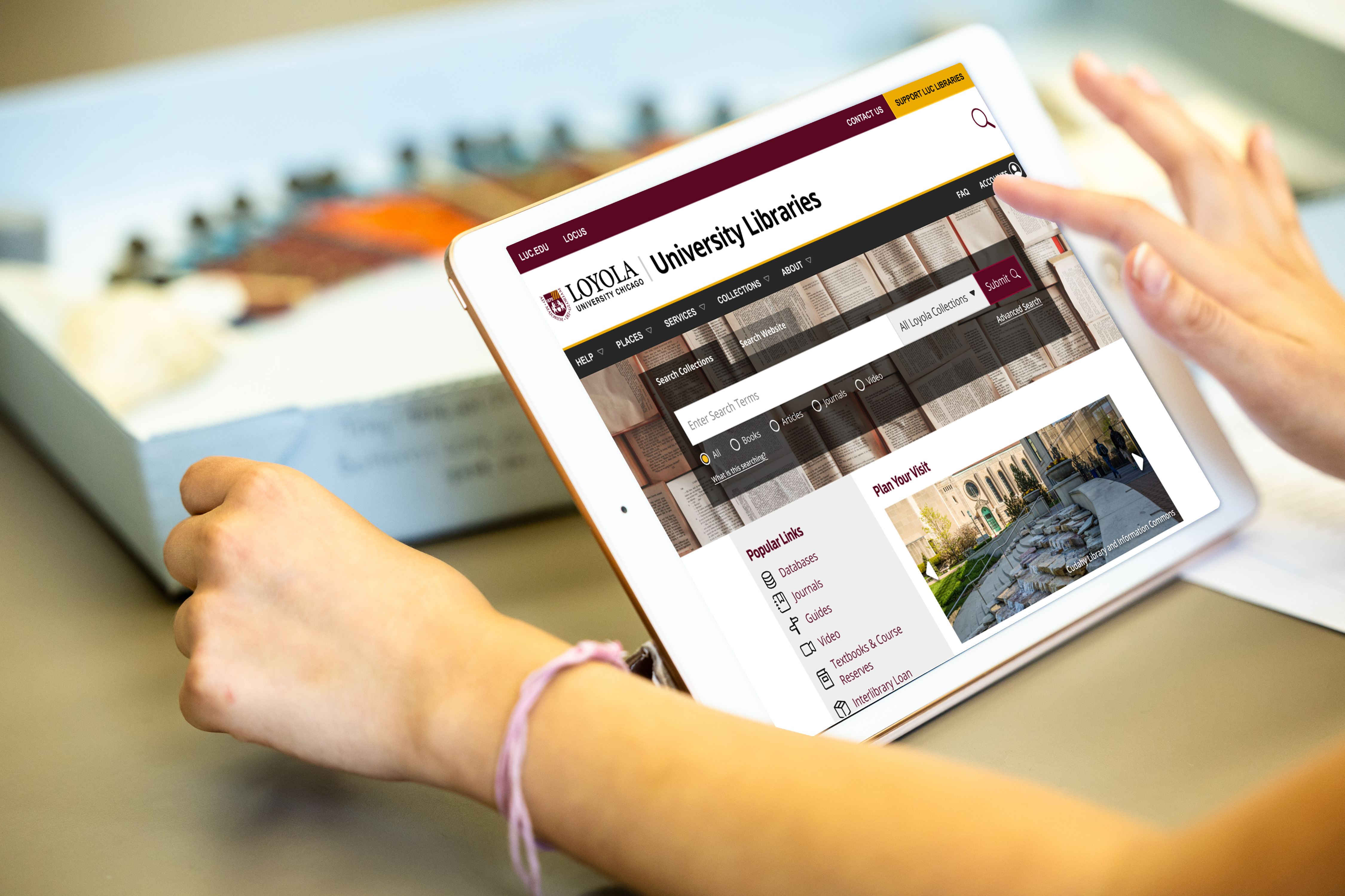 a person's finger touching the screen of a tablet