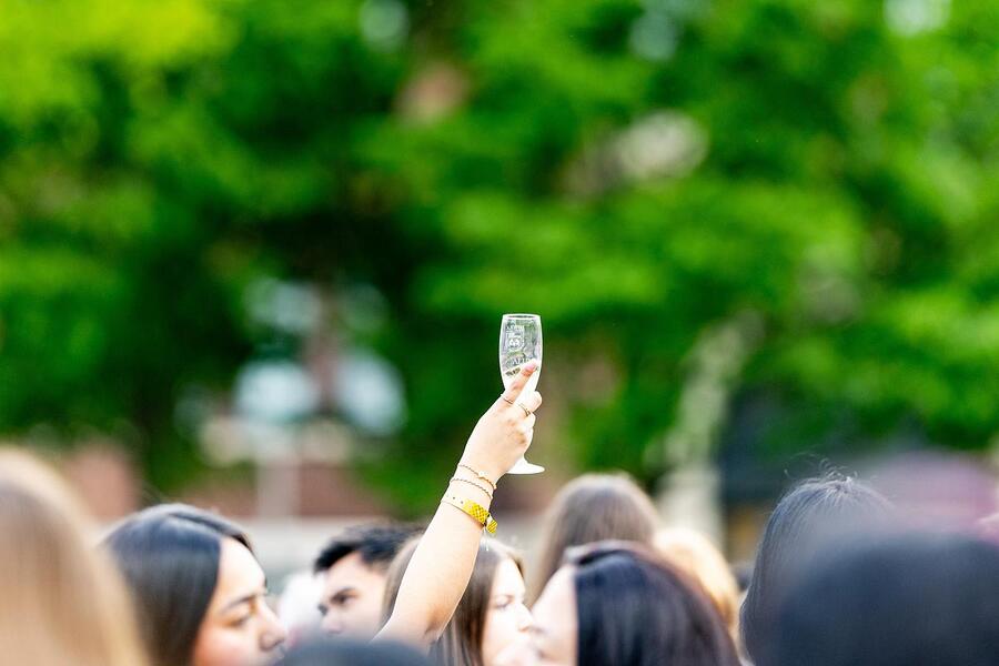 Class of 2026 graduates participate in the Senior Toast where they pass through the Cudahy Library doors for the final time. (Photo: Lukas Keapproth)